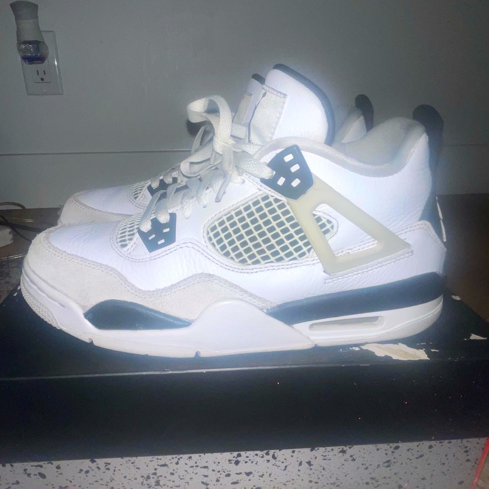 Black and white Jordan 4s